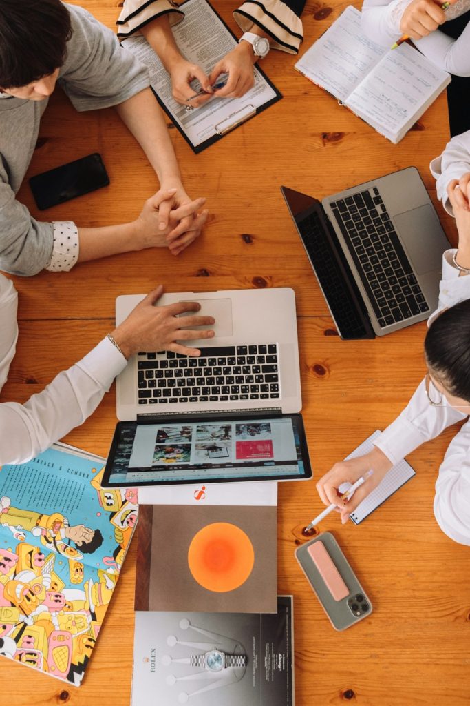 a-group-of-people-working-on-laptops-gqxpuau6mlu